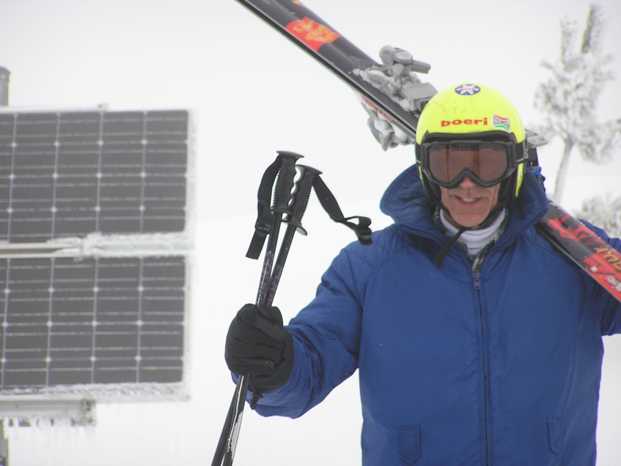 Dean skiing by solar panels
